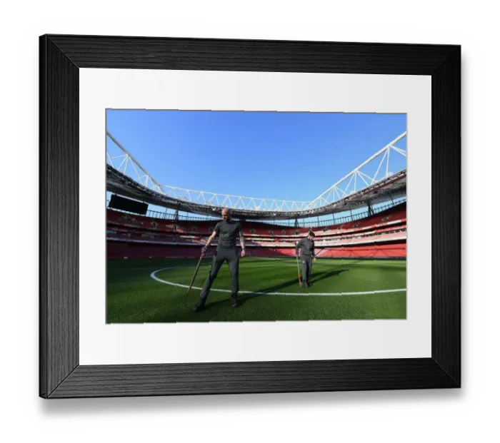 Framed Print : Arsenal Groundsmen's Meticulous Preparation for Emirates Stadium Pitch Ahead of Arsenal vs Bournemouth Match