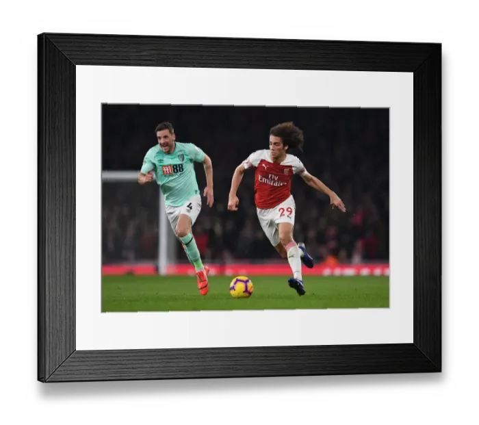 Framed Print : Intense Rivalry: Guendouzi vs. Gosling Clash at Arsenal's Emirates Stadium