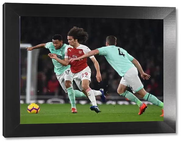 Arsenal's Guendouzi Clashes with Bournemouth's Gosling and King: A Tense Moment from the Premier League Match
