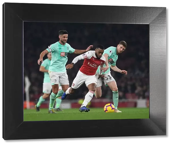 Arsenal's Lacazette Outmaneuvers Bournemouth's Surman and Mepham