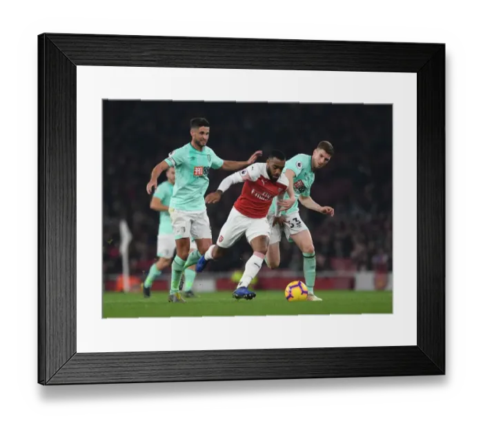 Framed Print : Arsenal's Lacazette Outmaneuvers Bournemouth's Surman and Mepham