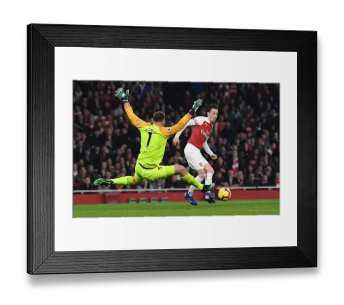 Framed Print : Mesut Ozil Evades Boruc: Arsenal vs Bournemouth, Premier League 2018-19