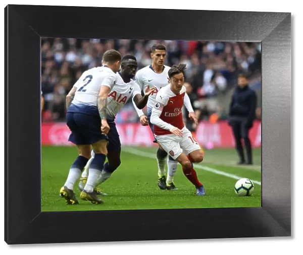 Mesut Ozil Clashes with Triple Threat: Tripper, Sanchez, and Lamela in Intense Tottenham-Arsenal Rivalry