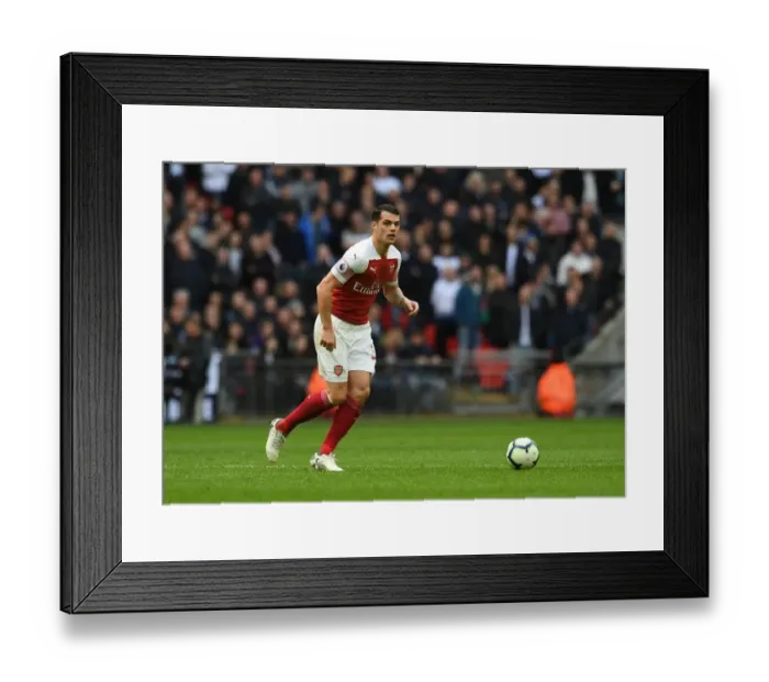 Framed Print : Granit Xhaka: In Action Against Tottenham in the 2018-19 Premier League Clash Framed Print : Granit Xhaka: In Action Against Tottenham in the 2018-19 Premier League Clash