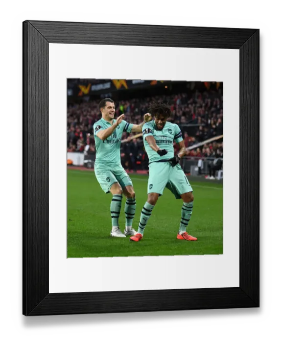 Framed Print : Arsenal's Europa League Victory: Iwobi and Xhaka's Unforgettable Goal Celebration vs. Stade Rennais