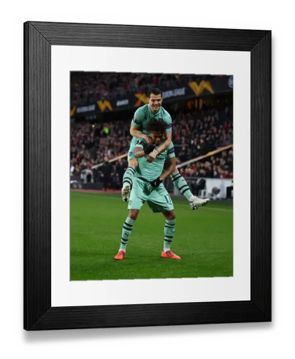 Framed Print : Arsenal's Europa League Victory: Unforgettable Goal Celebration between Iwobi and Xhaka Framed Print : Arsenal's Europa League Victory: Unforgettable Goal Celebration between Iwobi and Xhaka