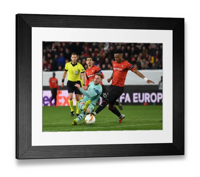 Framed Print : Ramsey vs Mexer: Clash in the Europa League as Arsenal Face Stade Rennais Framed Print : Ramsey vs Mexer: Clash in the Europa League as Arsenal Face Stade Rennais
