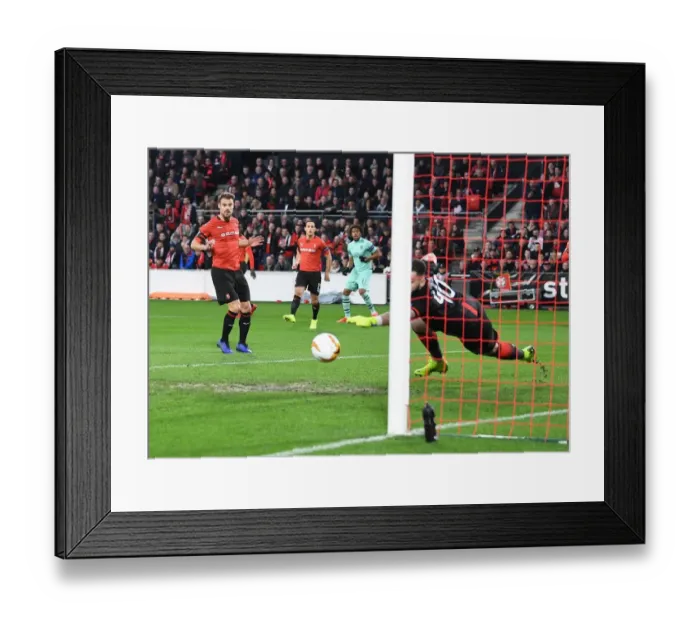 Framed Print : Alex Iwobi Scores the Winner: Arsenal Edge Past Rennes in Europa League First Leg