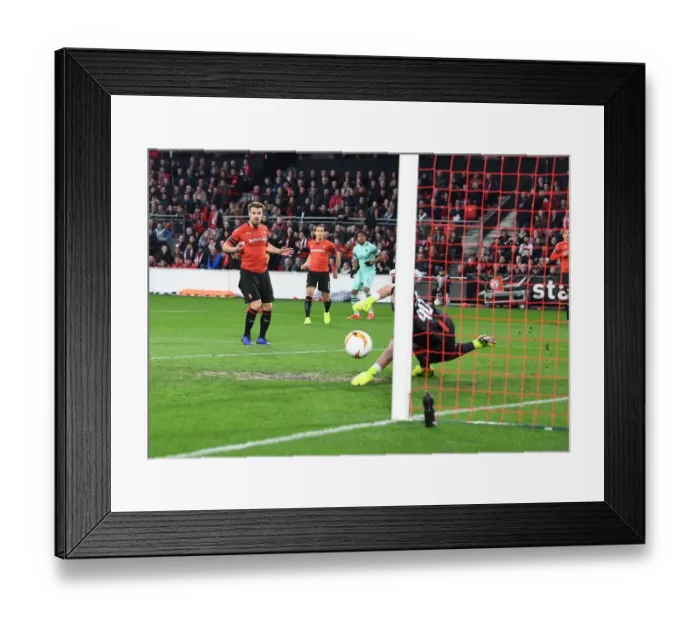 Framed Print : Arsenal's Alex Iwobi Scores Dramatic Goal Against Stade Rennais in Europa League First Leg