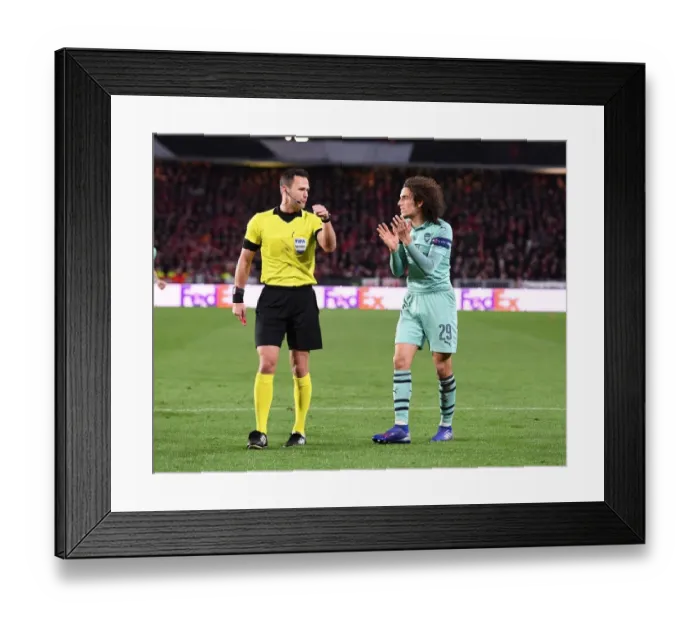 Framed Print : Arsenal's Guendouzi Protests Referee Decision in Stade Rennais Europa League Clash