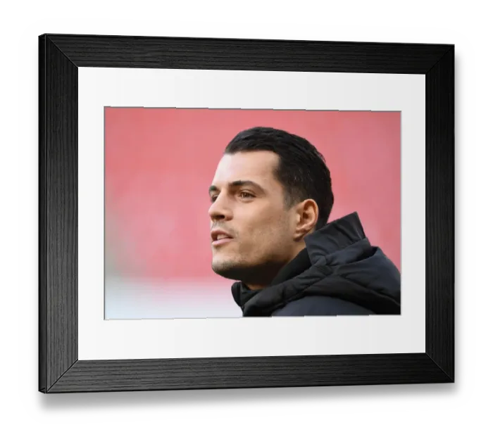 Framed Print : Granit Xhaka's Focus: Arsenal's Europa League Battle at Stade Rennais