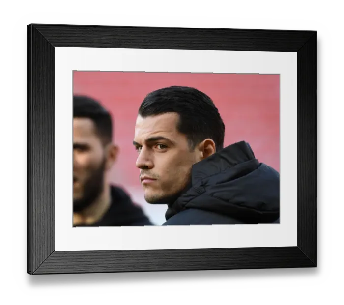Framed Print : Arsenal's Xhaka: Unwavering Focus in Europa League Clash at Stade Rennais