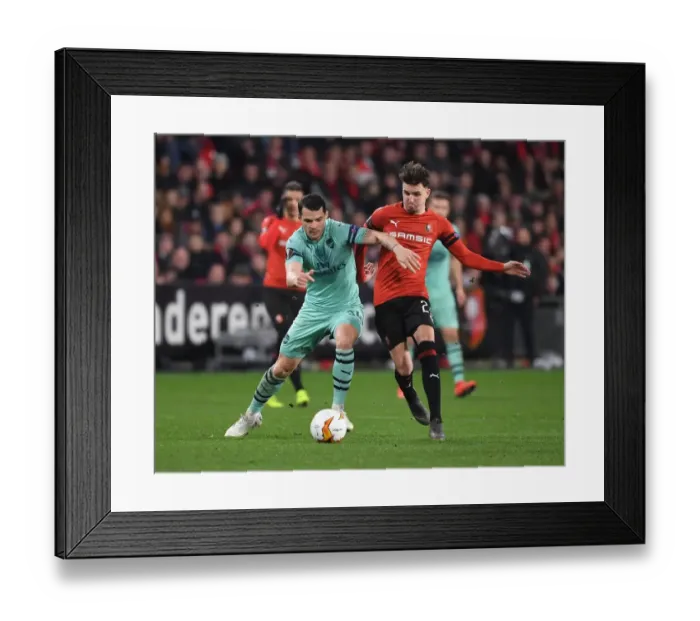 Framed Print : Granit Xhaka vs. Adrien Hunou: Clash of the Midfielders in Stade Rennais vs. Arsenal UEFA Europa League Clash Framed Print : Granit Xhaka vs. Adrien Hunou: Clash of the Midfielders in Stade Rennais vs. Arsenal UEFA Europa League Clash