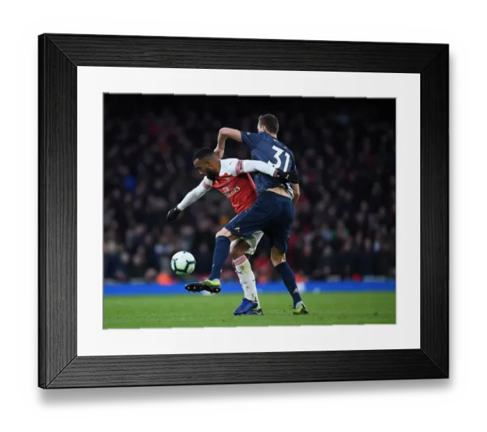 Framed Print : Arsenal vs Manchester United: Premier League Showdown at Emirates Stadium