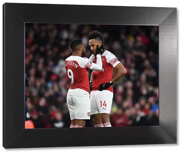 Arsenal's Aubameyang and Lacazette: A Team Bonding Moment Amidst Premier League Tension (Arsenal v Manchester United, 2018-19)