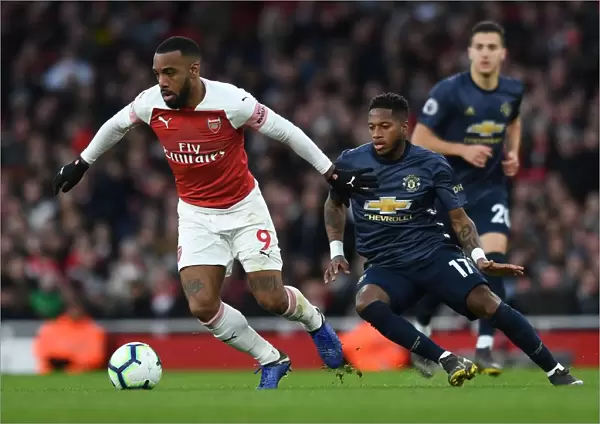 Arsenal's Lacazette Clashes with Manchester United's Fred in Premier League Showdown