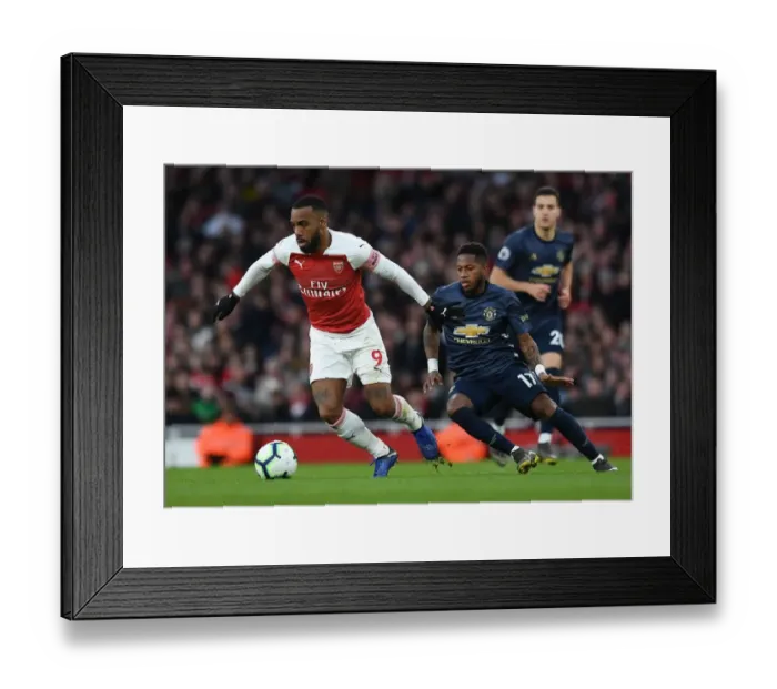 Framed Print : Arsenal's Lacazette Clashes with Manchester United's Fred in Premier League Showdown