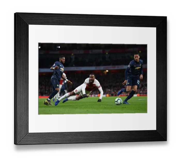 Framed Print : Arsenal's Lacazette Fouled by Fred in Intense Arsenal v Manchester United Clash (2018-19)