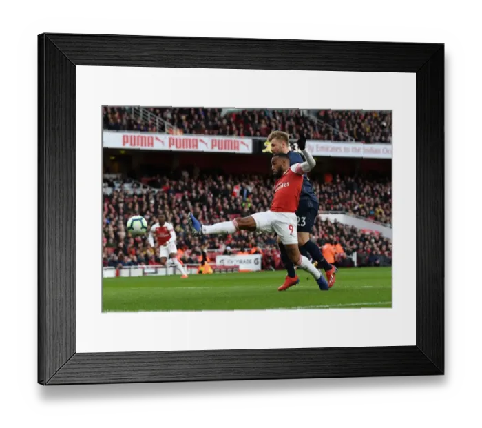 Framed Print : Clash at the Emirates: Lacazette vs Shaw in Arsenal's Battle Against Manchester United Framed Print : Clash at the Emirates: Lacazette vs Shaw in Arsenal's Battle Against Manchester United