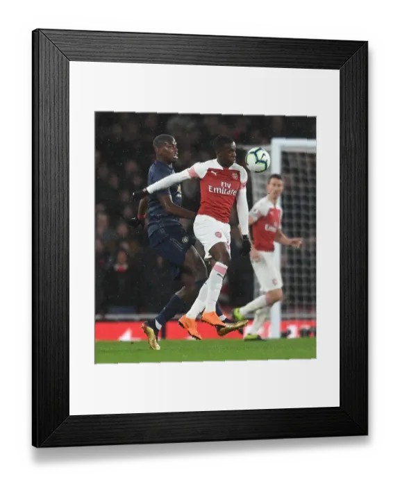 Framed Print : Clash of Titans: Nketiah vs. Pogba - Arsenal vs. Manchester United, Premier League