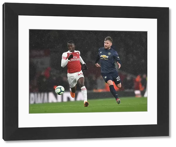 Arsenal's Eddie Nketiah Clashes with Manchester United's Luke Shaw in Premier League Showdown