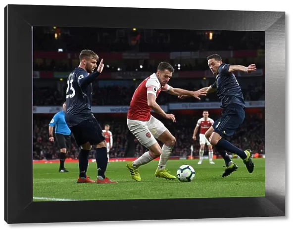 Arsenal's Aaron Ramsey Clashes with Manchester United's Luke Shaw and Nemanja Matic