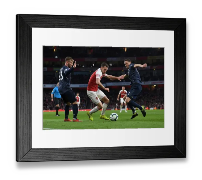 Framed Print : Arsenal's Aaron Ramsey Clashes with Manchester United's Luke Shaw and Nemanja Matic