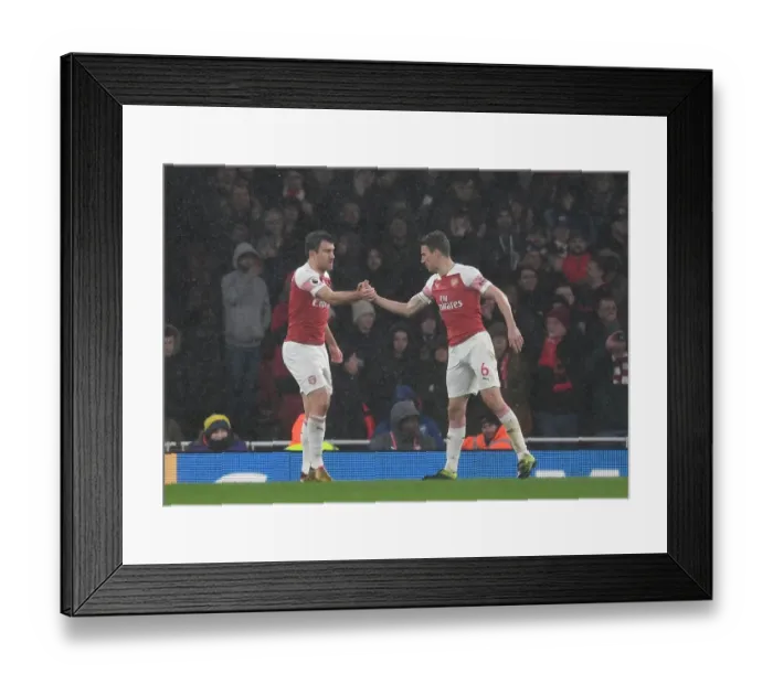 Framed Print : Arsenal's Unyielding Defensive Duo: Sokratis and Koscielny in Action against Manchester United (2018-19) Framed Print : Arsenal's Unyielding Defensive Duo: Sokratis and Koscielny in Action against Manchester United (2018-19)