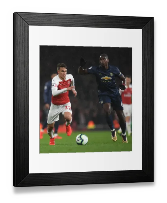 Framed Print : Clash of Midfield Titans: Suarez vs. Pogba - Arsenal vs. Manchester United, Premier League Framed Print : Clash of Midfield Titans: Suarez vs. Pogba - Arsenal vs. Manchester United, Premier League