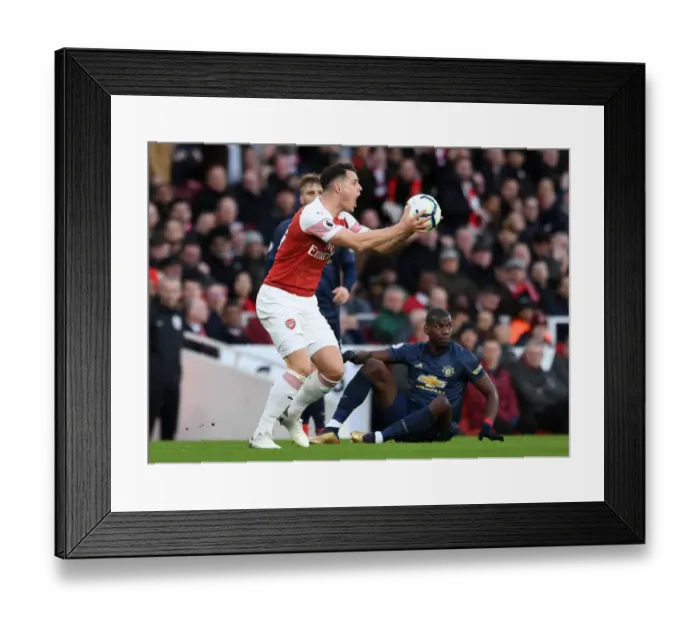 Framed Print : Xhaka vs Pogba: Intense Clash Between Arsenal's Granit Xhaka and Manchester United's Paul Pogba during the Premier League Match