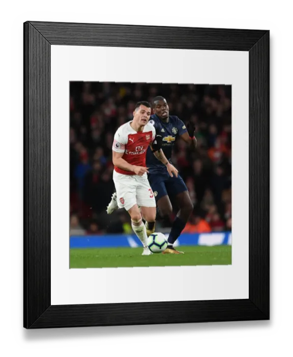 Framed Print : Clash of Midfield Titans: Xhaka vs Pogba - Arsenal vs Manchester United, Premier League Framed Print : Clash of Midfield Titans: Xhaka vs Pogba - Arsenal vs Manchester United, Premier League