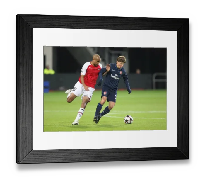 Framed Print : Arshavin vs. Poulsen: 1-1 Stalemate in the Champions League Clash between AZ Alkmaar and Arsenal, October 2009 Framed Print : Arshavin vs. Poulsen: 1-1 Stalemate in the Champions League Clash between AZ Alkmaar and Arsenal, October 2009