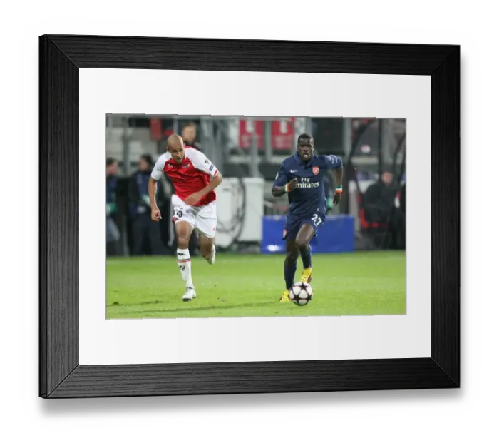 Framed Print : Eboue vs. Poulsen: 1:1 Stalemate in the Champions League Framed Print : Eboue vs. Poulsen: 1:1 Stalemate in the Champions League