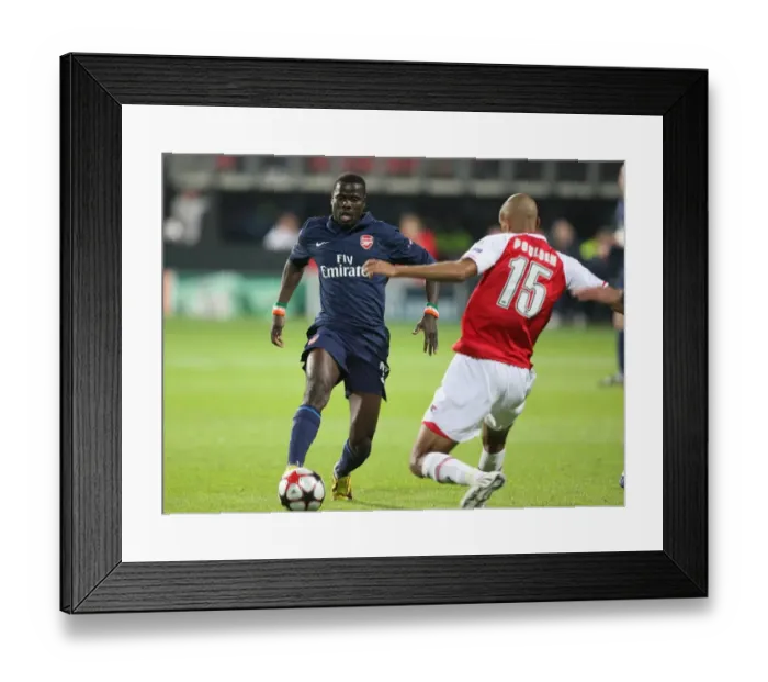 Framed Print : Champions League Clash: Eboue vs. Poulsen - Arsenal vs. AZ Alkmaar Ends in a 1:1 Draw
