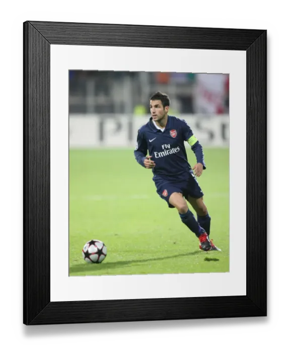 Framed Print : Cesc Fabregas Leads Arsenal's UEFA Champions League Battle at DSB Stadium