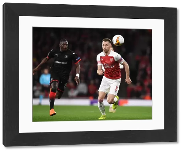 Arsenal's Aaron Ramsey Scores Past Rennes Hamari Traore in Europa League Showdown