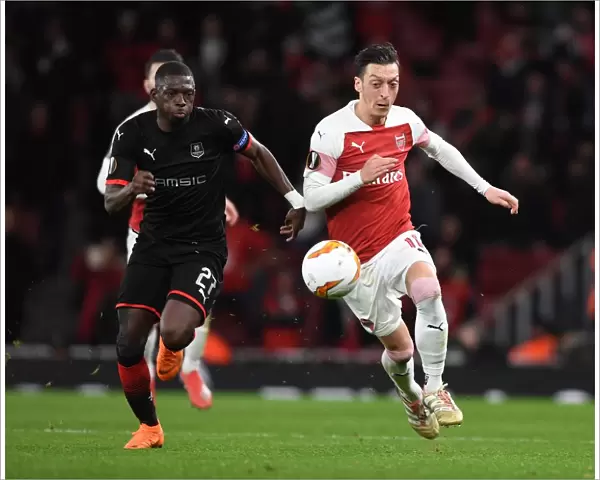 Clash of the Stars: Mesut Ozil vs. Hamari Traore in Arsenal's Europa League Showdown against Stade Rennais