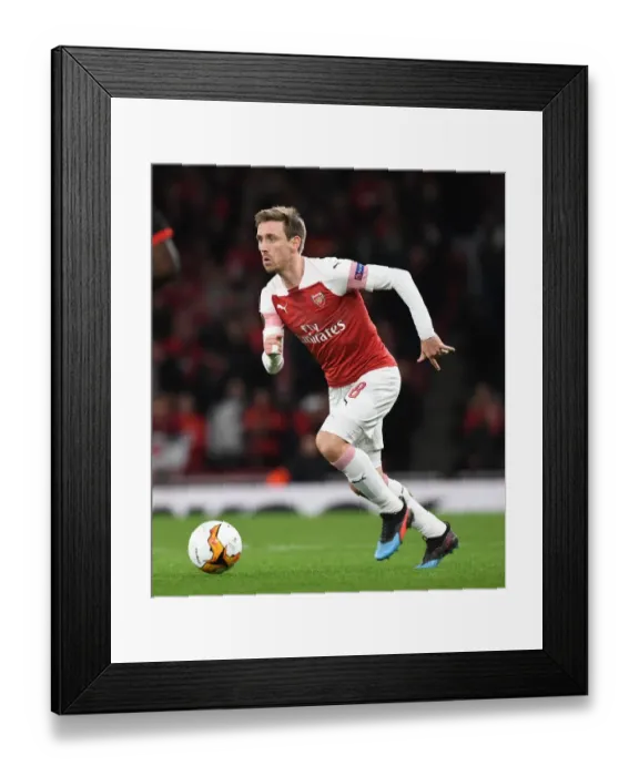 Framed Print : Arsenal's Nacho Monreal in Action against Stade Rennais in the Europa League Second Leg Framed Print : Arsenal's Nacho Monreal in Action against Stade Rennais in the Europa League Second Leg