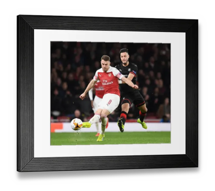 Framed Print : Arsenal's Aaron Ramsey Scores Past Rennes Ramu Bensebaini in Europa League Showdown Framed Print : Arsenal's Aaron Ramsey Scores Past Rennes Ramu Bensebaini in Europa League Showdown