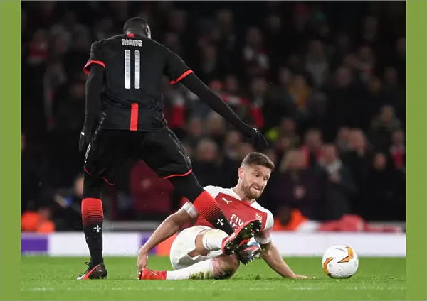 Arsenal vs. Stade Rennais: Mustafi Tackles Baye Niang in Europa League Showdown