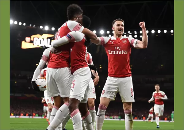 Aaron Ramsey and Pierre-Emerick Aubameyang Celebrate Arsenal's Goal Against Stade Rennais in UEFA Europa League