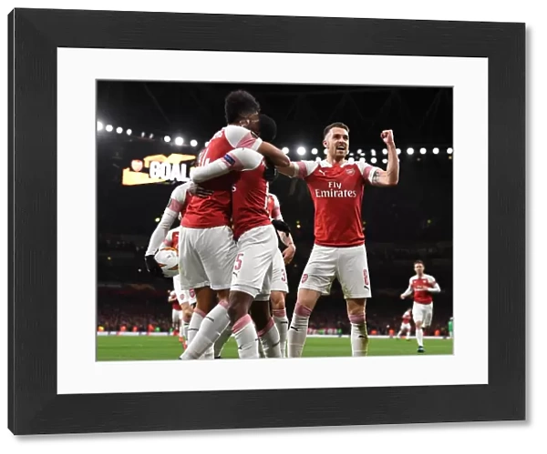 Aaron Ramsey and Pierre-Emerick Aubameyang Celebrate Arsenal's Goal Against Stade Rennais in UEFA Europa League