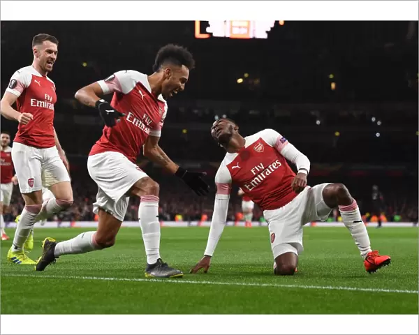 Arsenal's Maitland-Niles and Aubameyang Celebrate Goals: Europa League Victory over Stade Rennais (2018-19)