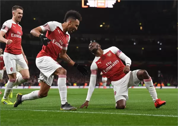 Arsenal's Maitland-Niles and Aubameyang Celebrate Goals: Europa League Victory over Stade Rennais (2018-19)