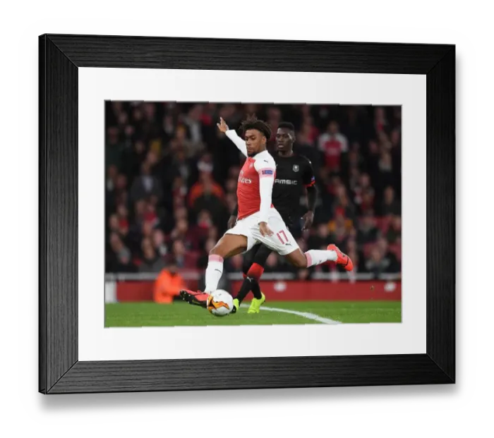 Framed Print : Arsenal's Alex Iwobi Faces Off Against Ismaila Sarr in Intense Europa League Clash