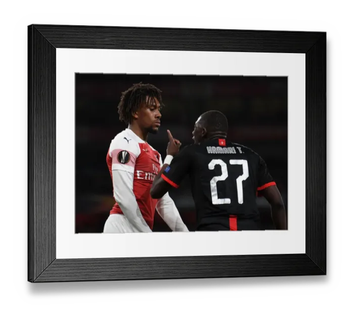 Framed Print : Arsenal's Alex Iwobi Faces Off Against Hamari Traore in Europa League Clash Framed Print : Arsenal's Alex Iwobi Faces Off Against Hamari Traore in Europa League Clash