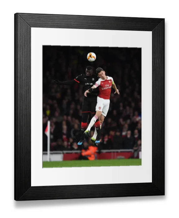 Framed Print : Laurent Koscielny (Arsenal) M Baye Niang (Rennes) Framed Print : Laurent Koscielny (Arsenal) M Baye Niang (Rennes)