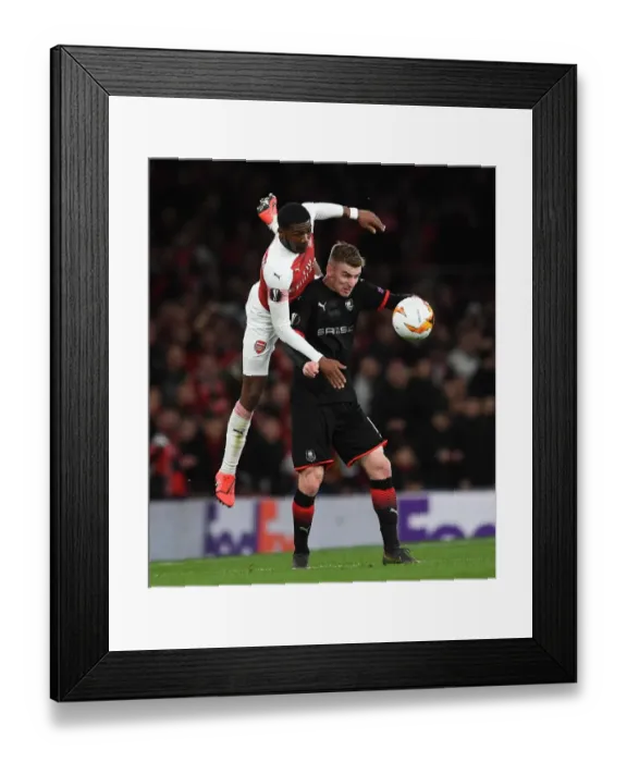 Framed Print : Arsenal vs. Stade Rennais: Ainsley Maitland-Niles and Benjamin Bourigeaud in Intense Europa League Clash Framed Print : Arsenal vs. Stade Rennais: Ainsley Maitland-Niles and Benjamin Bourigeaud in Intense Europa League Clash