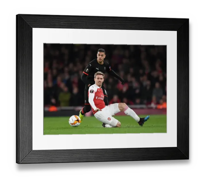 Framed Print : Monreal vs Ben Arfa: Intense Clash in Arsenal's Europa League Battle Against Stade Rennais Framed Print : Monreal vs Ben Arfa: Intense Clash in Arsenal's Europa League Battle Against Stade Rennais