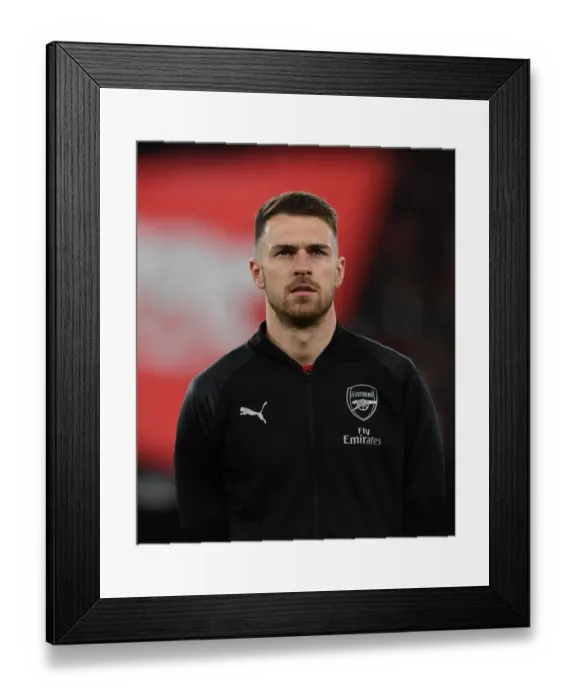 Framed Print : Aaron Ramsey: Focused Ahead of Arsenal's Europa League Showdown Against Stade Rennais